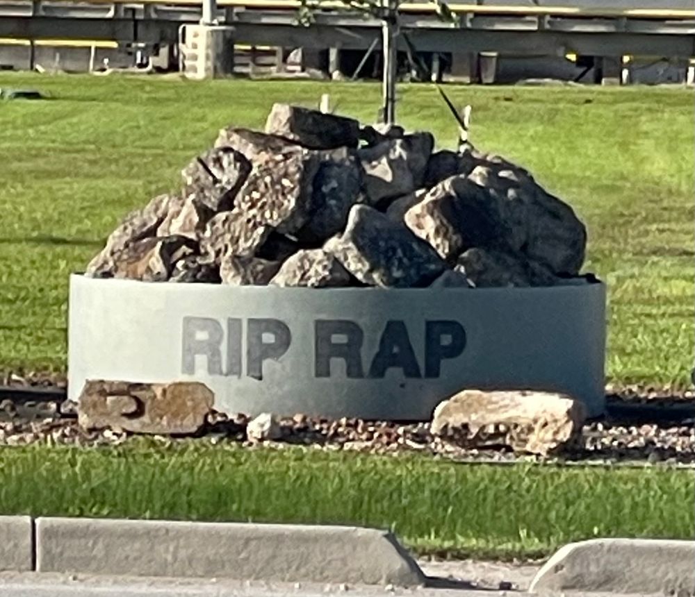Photo of container full of rocks labeled “Rip Rap.”