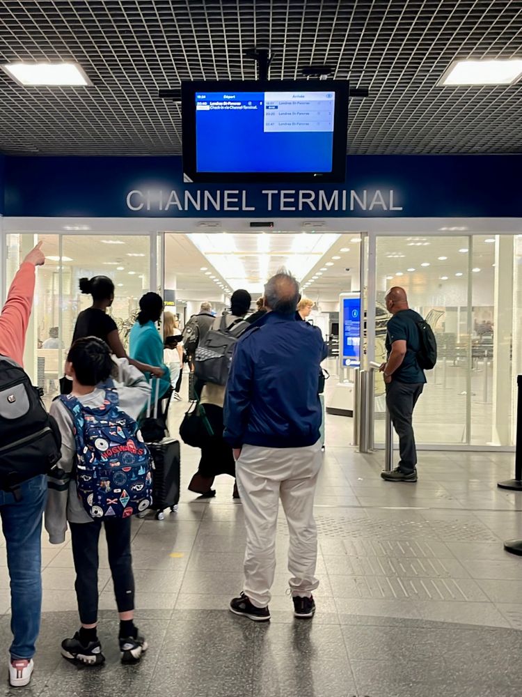 Entrance to the Eurostar terminal in Brussels with some people in front