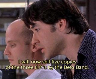 A meme from the film high fidelity. John Cusack's character is leaning toward's a coworker's ear. He says, "I will now sell five copies of The Three E.P.'s by The Beta Band.