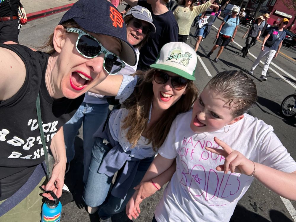Four women. 3 generations. 3 are wearing hats