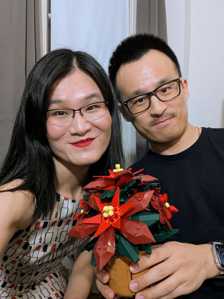 An esteemed young legal scholar and his weird aunty with a Lego poinsettia they made together.