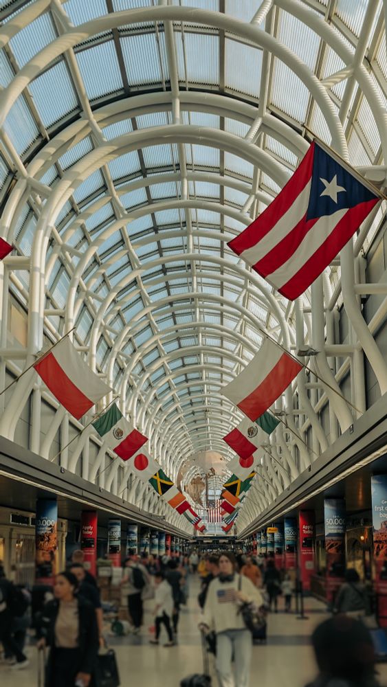A picture of flags from many nations in ORD airport.