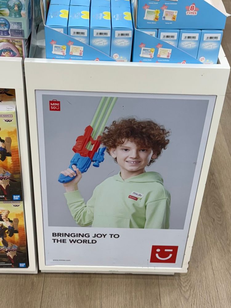 this child is clearly brandishing a shotgun, albeit a toy one, because America