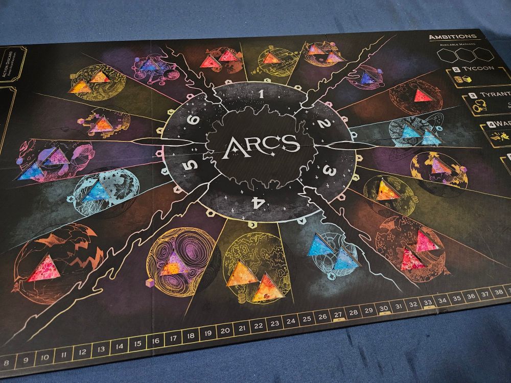 the board for the game arcs. the triangular building slots have been cut out and watercolor paintings have been attached underneath.