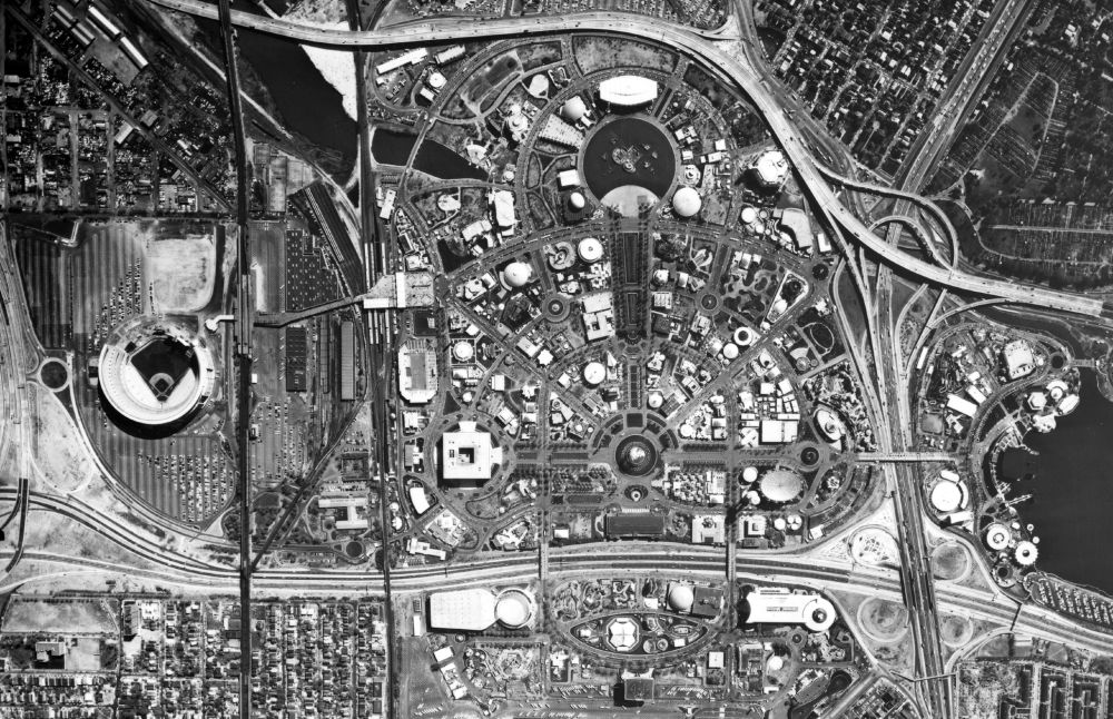 An aerial view of the 1964-1965 World's Fair fairgrounds. North is to the left in this view, which highlights the layout of the fair. To the left is the old Shea Stadium, and between the stadium and the fairgrounds the Flushing subway and LIRR line can be seen. 