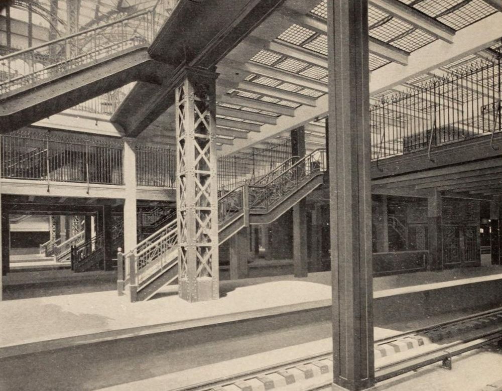Track level, showing stairways and elevators leading to the exit concourse.