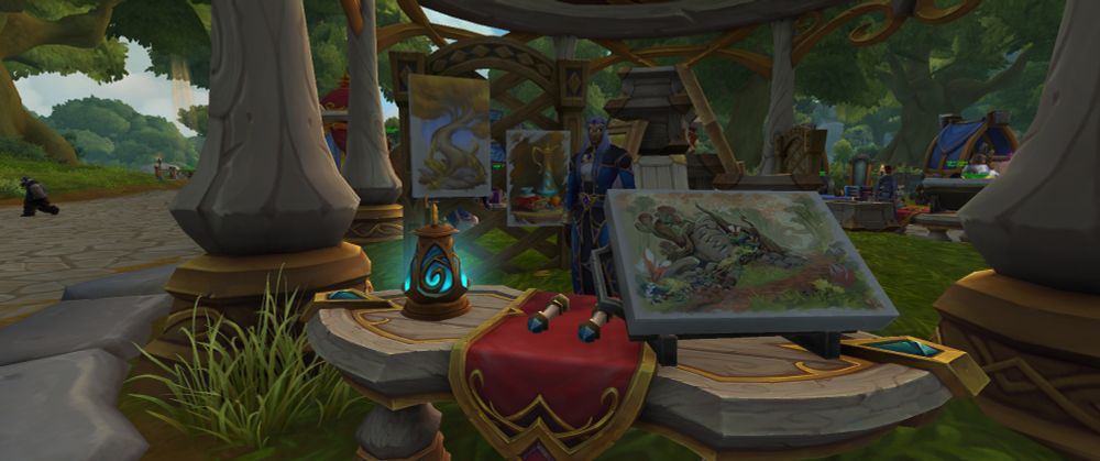 Screenshot of beautiful paintings laid out under a vendor's tent. From the Alliance housing neighborhood in WoW's Midnight Beta.