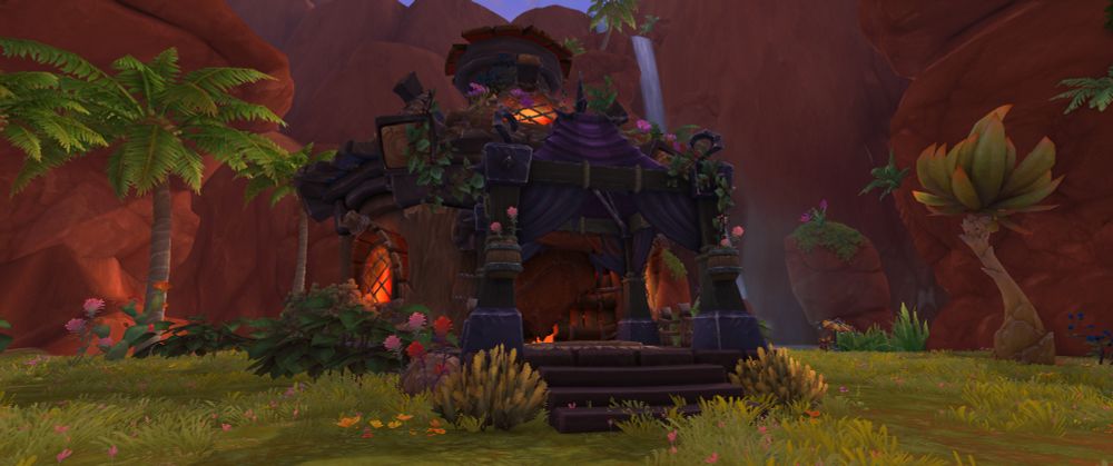 Screenshot of my house in the Horde Neighborhood - World of Warcraft beta. A flower and vine adorned house with a custom entrance that I put together out of various decor pieces.