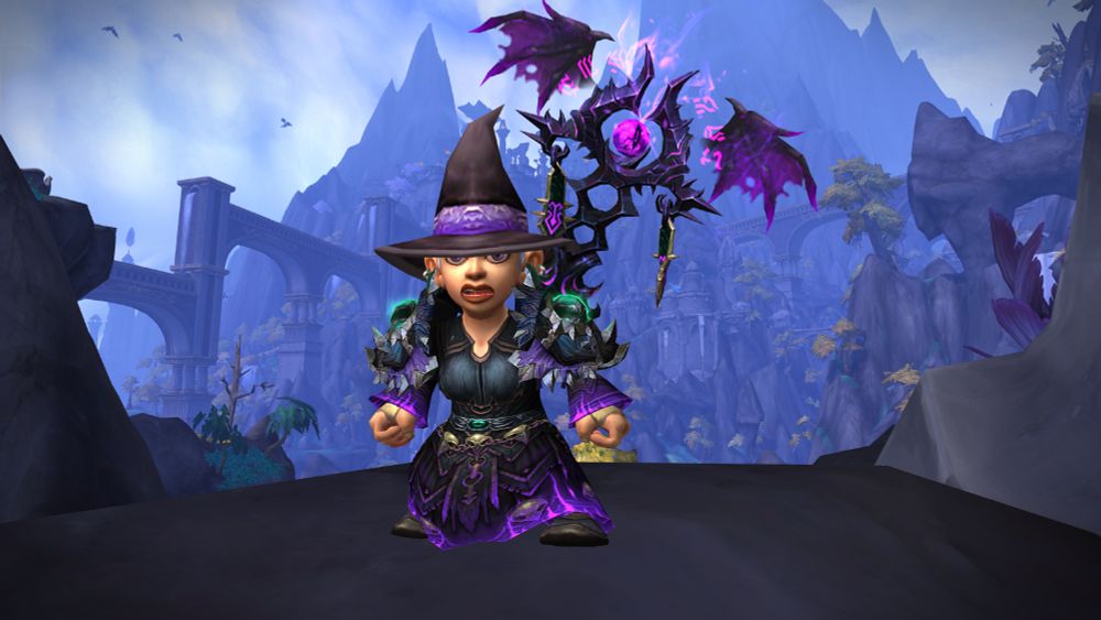 Screenshot of my warlock toon from World of Warcraft. dressed in her finest scariest mog for Hallow's End. She looks bewitching in her black and purple garb.