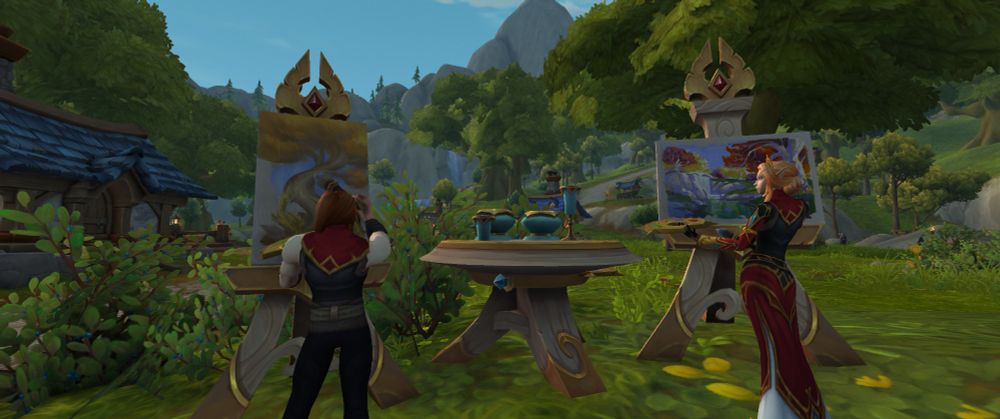 Screenshot of artists outdoors, standing up and painting landscapes on easels. A table with bowls and glasses sits between tem. The background is filled with green trees.