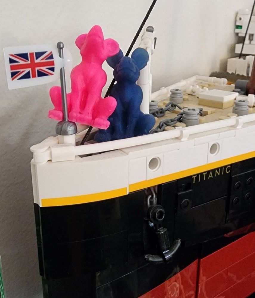 A pink and a blue mini Lyca Squishable on a Lego Titanic