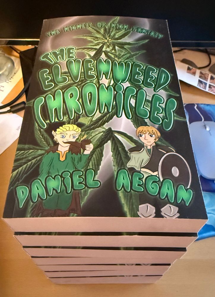 A stack of paperback books. 

The highest of high fantasy! 
The Elvenweed Chronicles by Daniel Aegan. 

Cover shows an elf with a pipe in his mouth and a squire holding a shield in front of a pot plant and some smoke.  