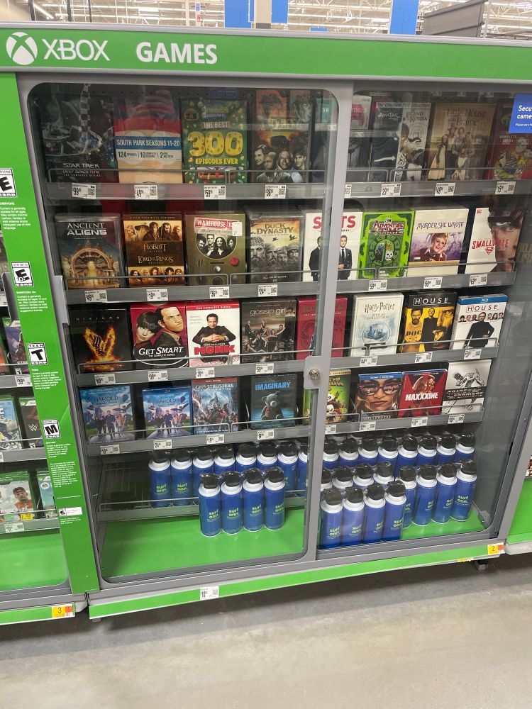 Walmart Xbox display case filled with DVDs/Blu-rays




