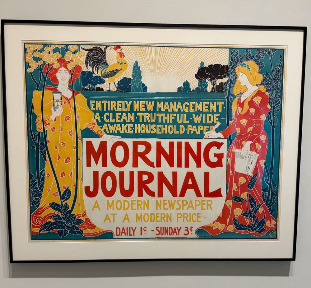 1895 Morning Journal art nouveau  advertisement. Saturated blue, yellow, and red colors. Two women in long gowns flank the writing, which looks like a sign and says "Entirely new management. A clean truthful wide awake household paper. Morning Journal. A modern newspaper at a modern price. Daily 1 cent. Sunday 3 cents." A rooster stands atop the sign, crowing in front of sun rays depicting the start of a new day.