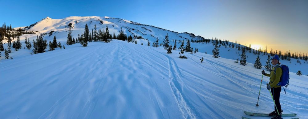 Panoramic view of Mt. St. Helens from just above Chocolate Falls, with the sun starting to peek above the ridge.