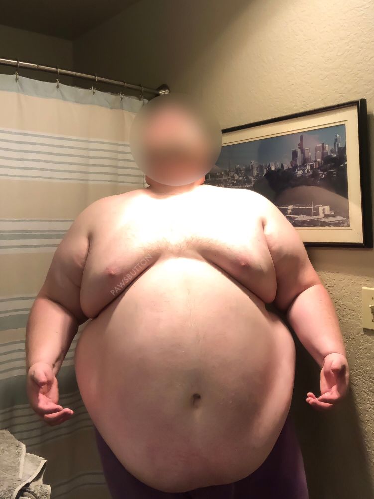 Unrepentantly fat guy under a heat lamp