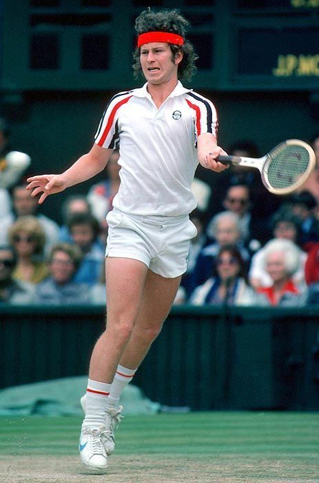 John McEnroe pretending to be a t-rex playing tennis