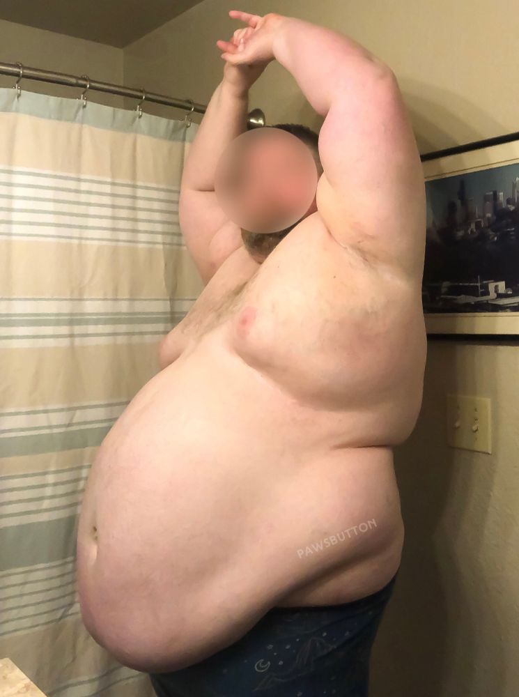A fat guy stretching in 3/4 profile 