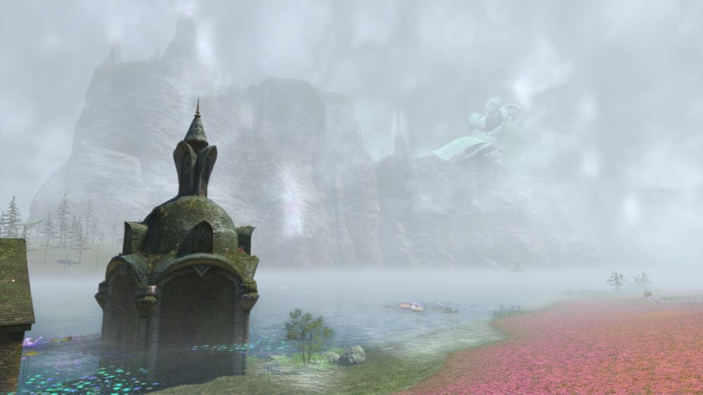 Landscape view of the mountains surrounding Il Mheg. In the fog lies a sleeping giant, Mamani Mani, the slumbering Lightwarden.