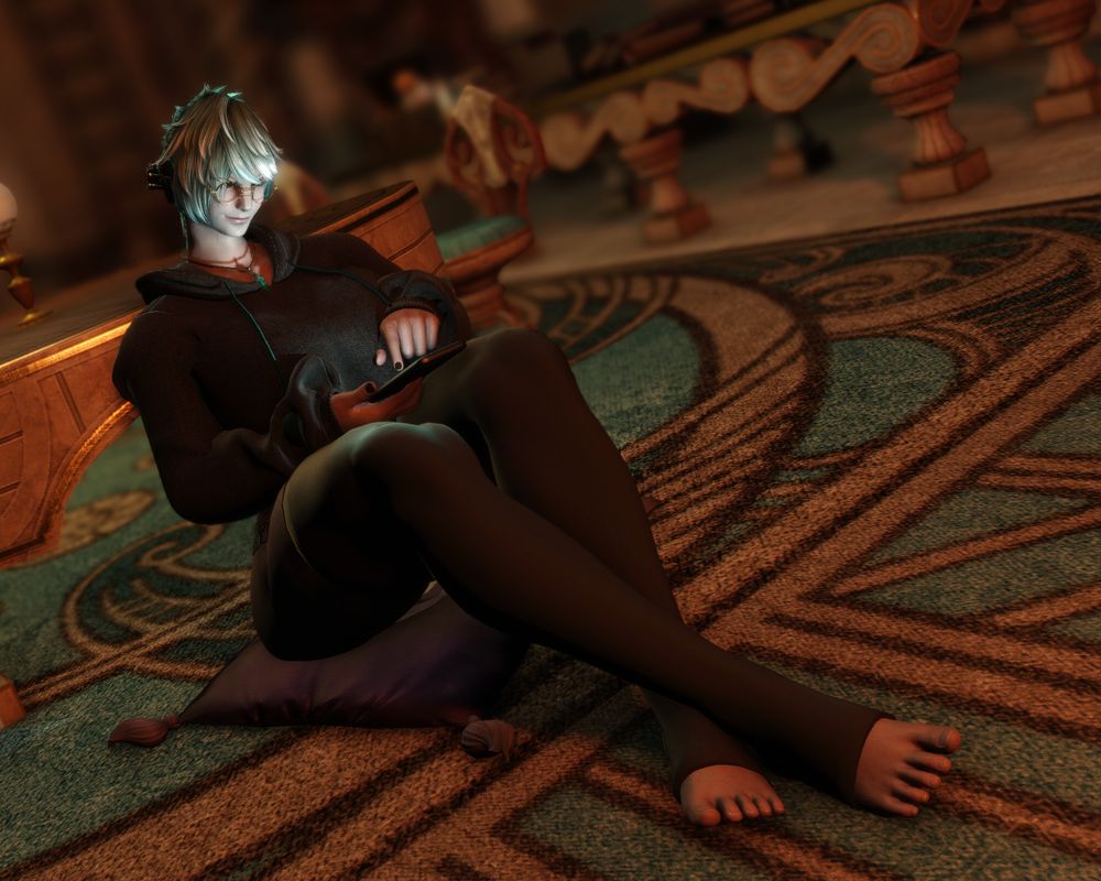 FFXIV character Mamani Mani sitting in a room in Old Sharlayan, looking at video's on her tomestone.
