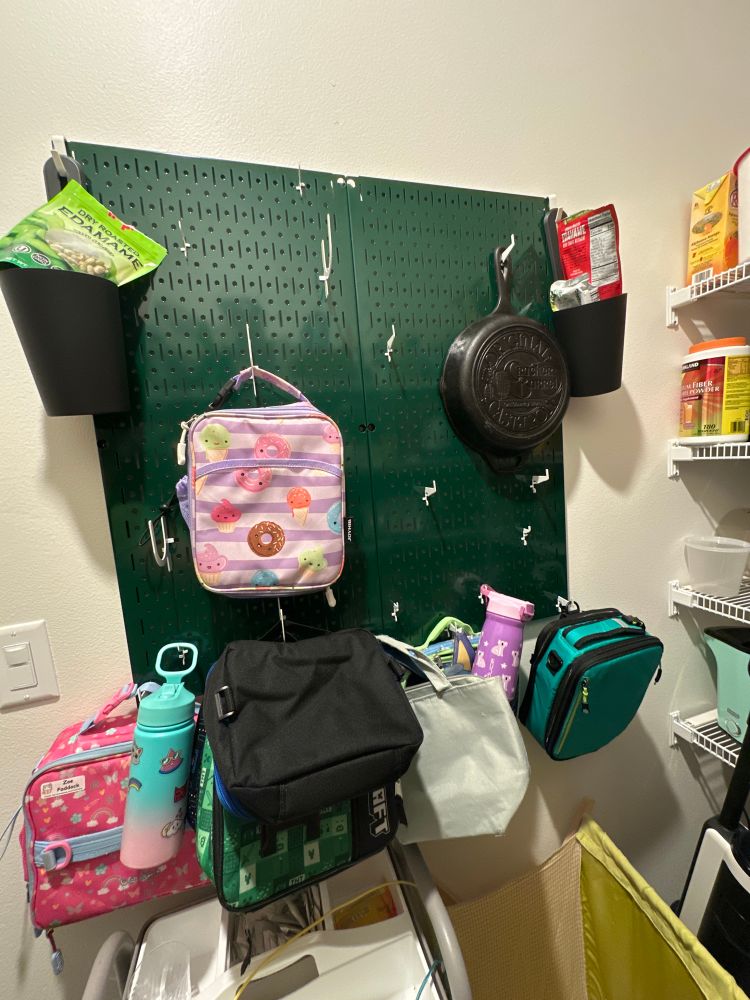 It’s a green metal pegboard. It’s not exciting. Sorry. 