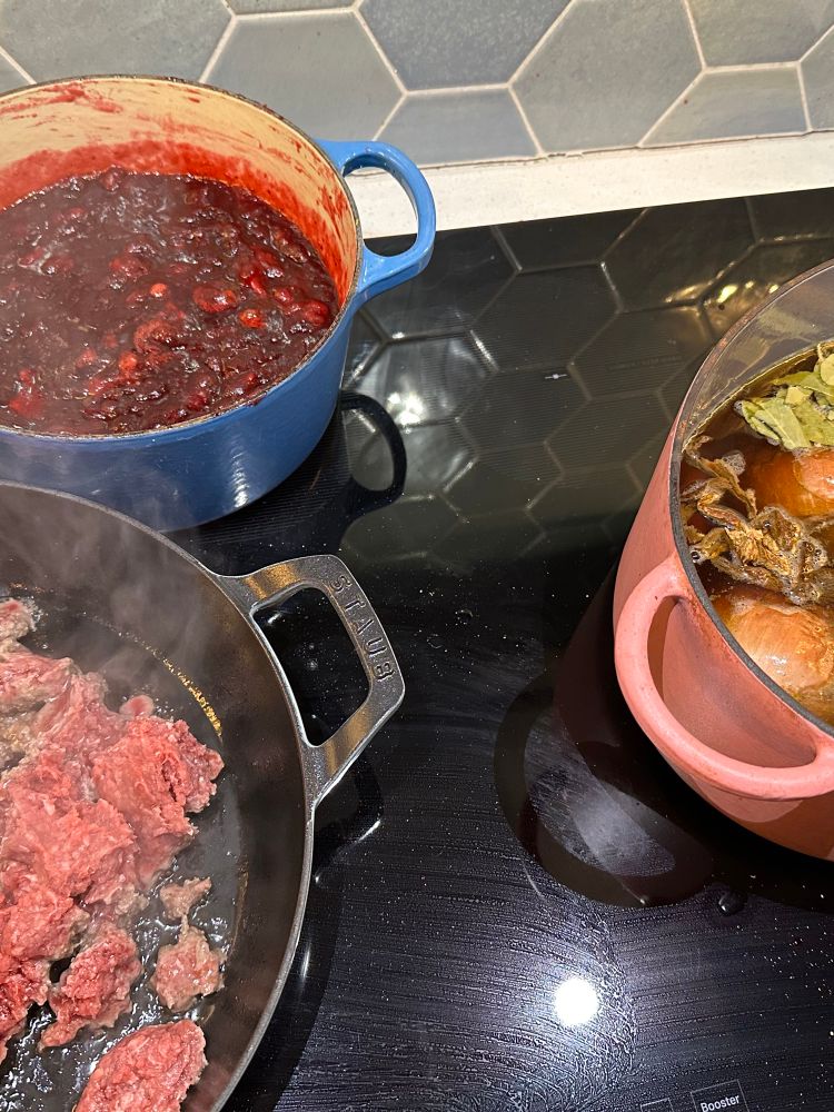 Cranberry sauce and turkey stock on the stove. Also tacos. 