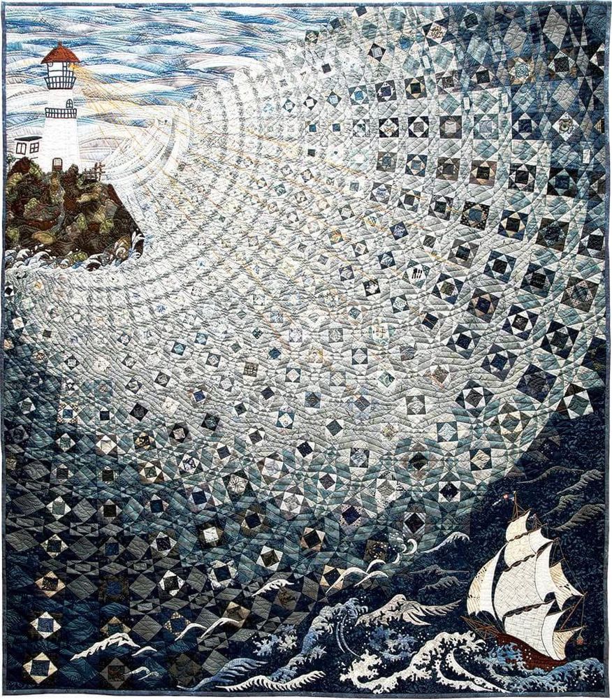 This stunning quilt - 'Over The Waves' by Setsuko Matsushima features the iconic 'Storm at Sea' patchwork block.
“A huge tsunami occurred in Japan in March of 2011. I made this quilt to honor the people who sacrificed. I hope all people receive this light as a ray of hope from a lighthouse.“ ~ Setsuko Matsushima.
Awarded The Founders Award International Quilt Festival, Houston 2018.  