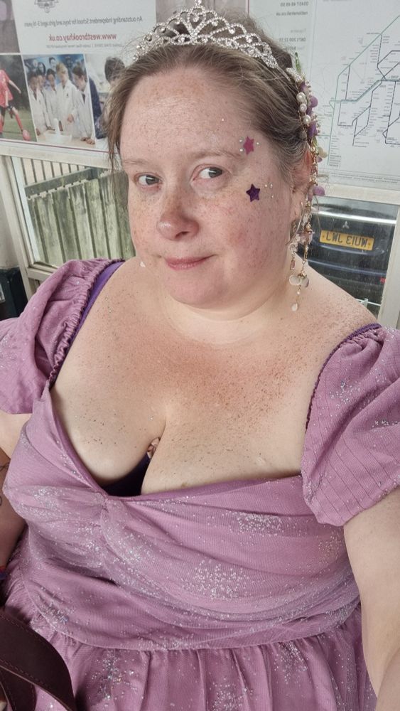 Me in my pink dress and tiara and star stickers 