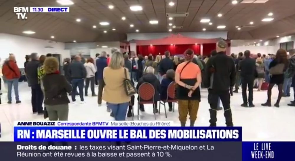 BFM filmant le rassemblement de soutien à Marine Le Pen à Marseille.
