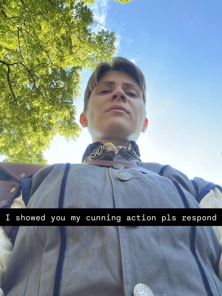 low angle selfie from the Renaissance Faire with the caption superimposed snapchat-style “I showed you my cunning action pls respond”