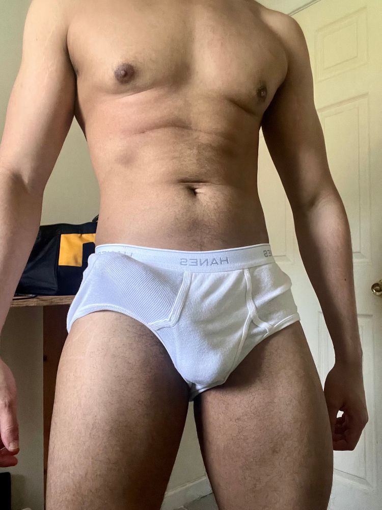 Posing with a visible erection in my white Hanes briefs