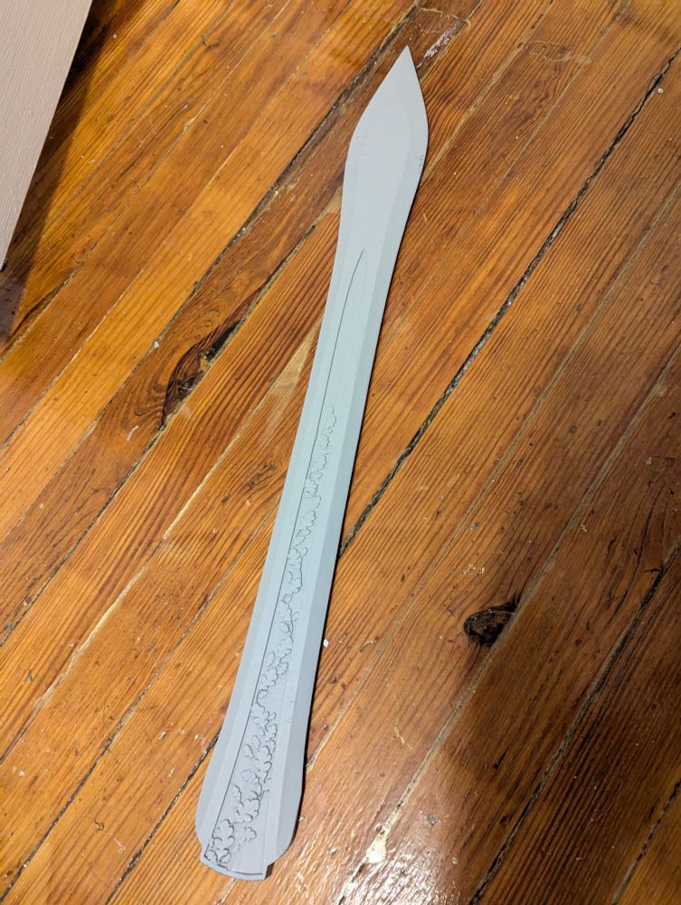 W.I.P. of Orym's sword. It's just the blade painted with grey primer. There is a leaf design down the center of the blade