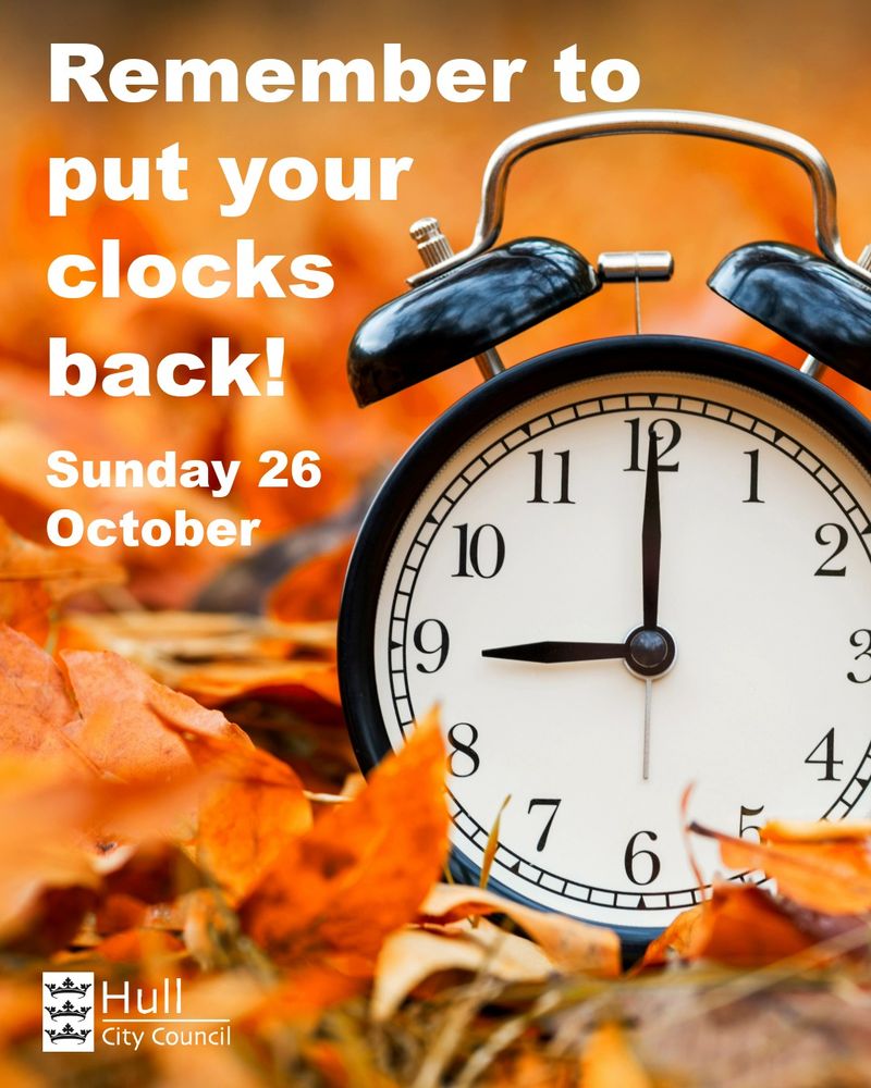 A black alarm clock shows 9pm on the clock face and is nestled amongst orange and brown autumn leaves. The text reads Remember to put your clocks back! Sunday 26 October. The Hull City Council logo is in the bottom left corner.