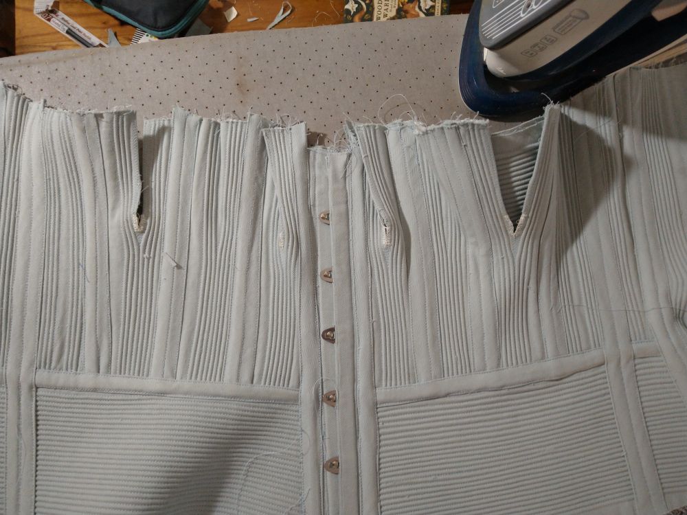 Not seeing a bunch of seams, they've been enclosed in the corset's boning channels.