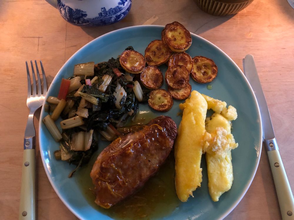 The aforementioned items on a blue plate with cutlery with duck egg blue plastic handles that I got in the Manchester habitat when I got my first council flat in 2003