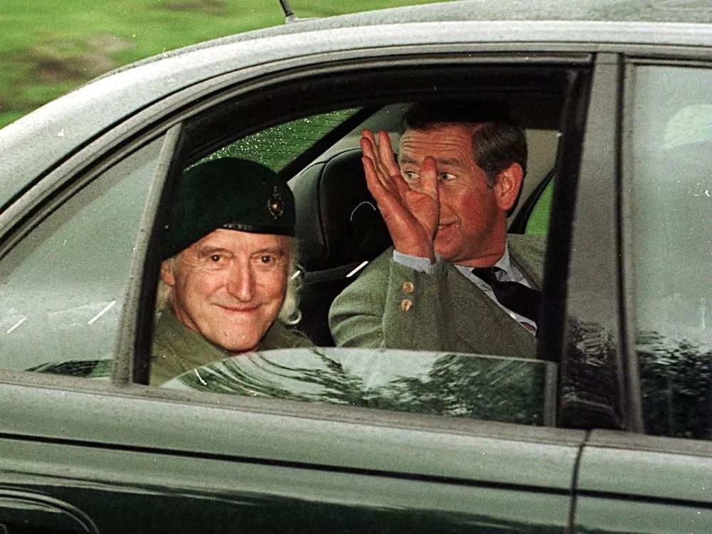 Jimmy Saville and Prince Charles in the back of a car