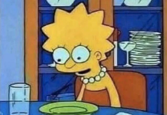 Still frame of Lisa Simpson from 'The Simpsons' sighing over her dinner plate