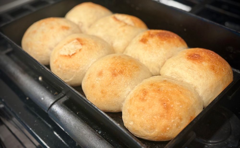 Potato buns cooling on a stovetop 