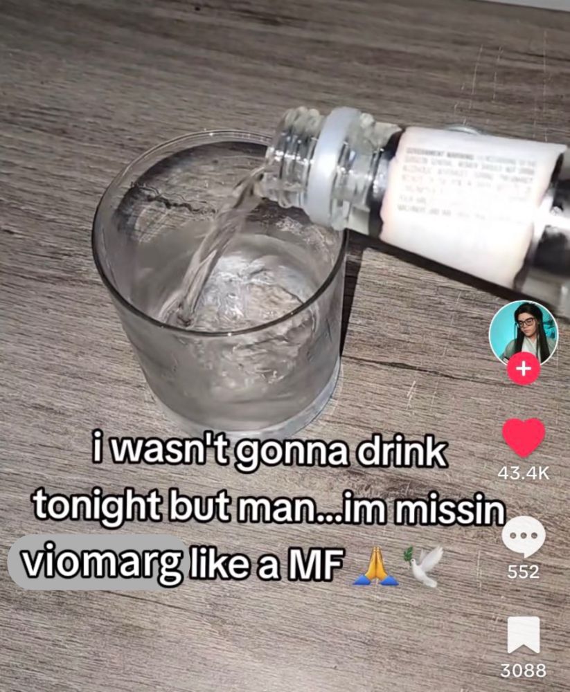 a photo of someone pouring out an alcoholic drink into a shotglass. it's captioned "i wasn't gonna drink tonight but man... i'm missing viomarg like a MF" with a praying emoji and a dove emoji.