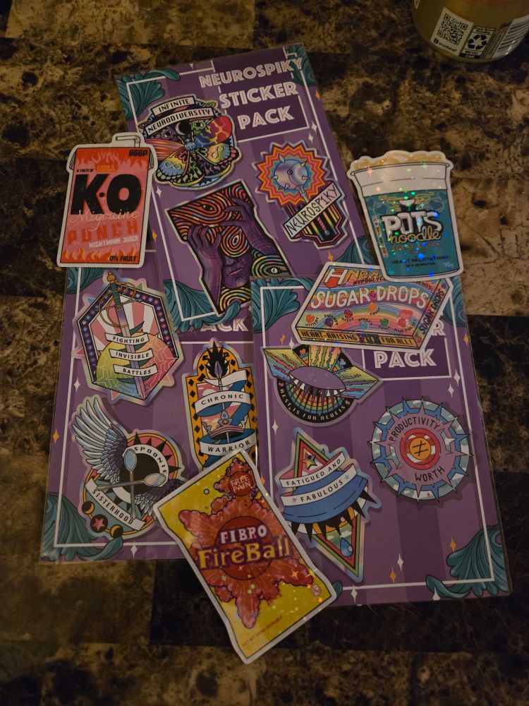 3 packs of stickers and 4 individual stickers stacked partially on top of each other including "Neurospicy Sticker Pack," POTS noodle, Fibro FireBall, Hypo-[cut off] Sugar Drops, KO Migraine Punch,  Fighting Invisible Battles, Spoonie Sisterhood, Fatigued and Fabulous, Productivity (does not equal) Worth, and Rest is for Rebels