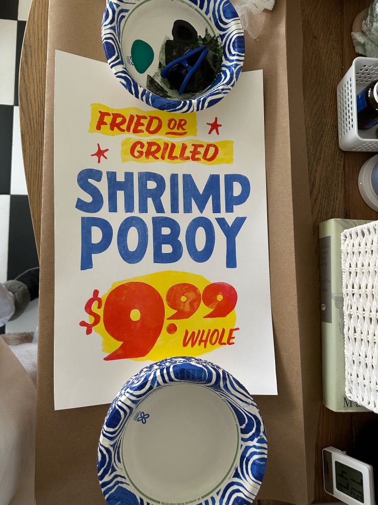 A red, blue, and yellow print that reads 

FRIED OR GRILLED
SHRIMP POBOY
$9.99 WHOLE