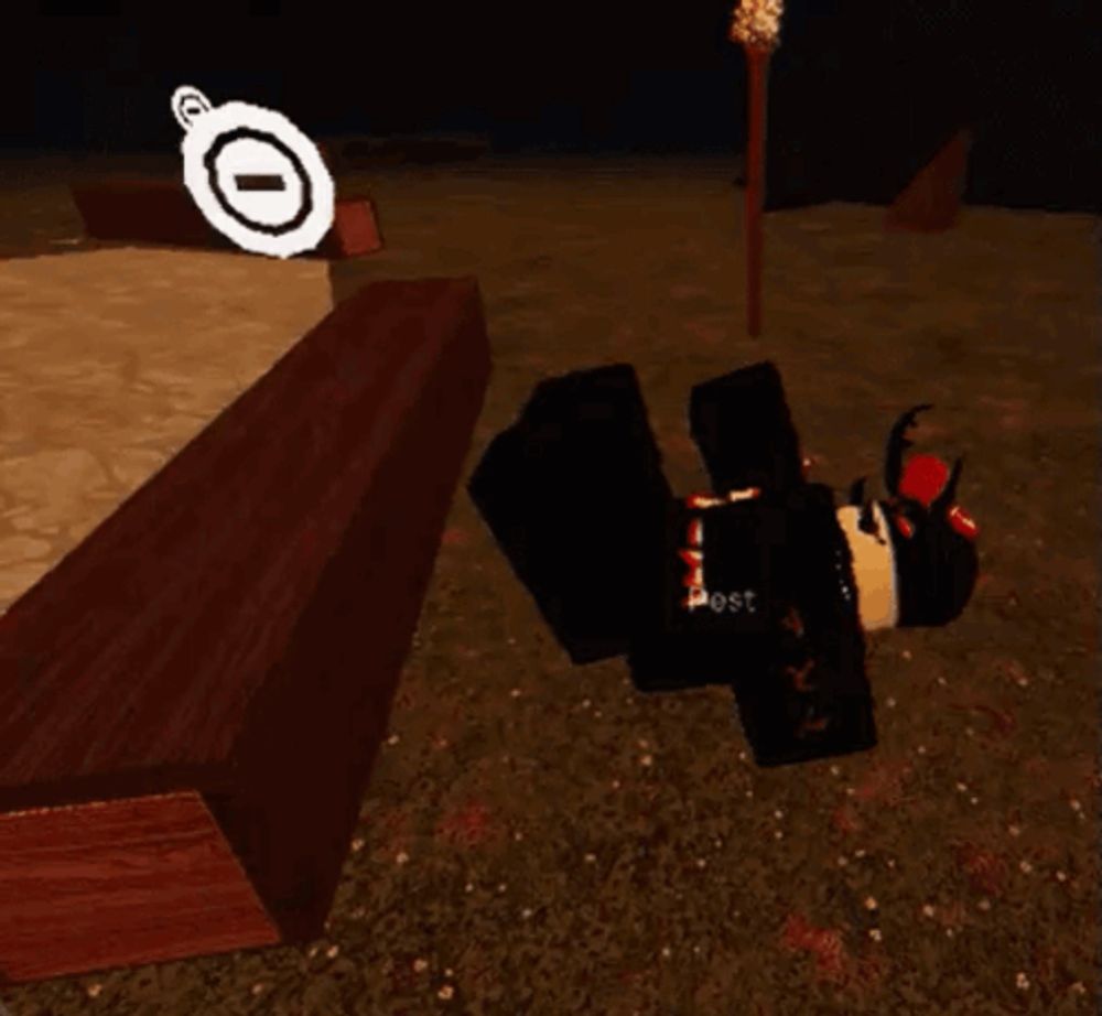 a roblox character is laying on the ground next to a wooden box .