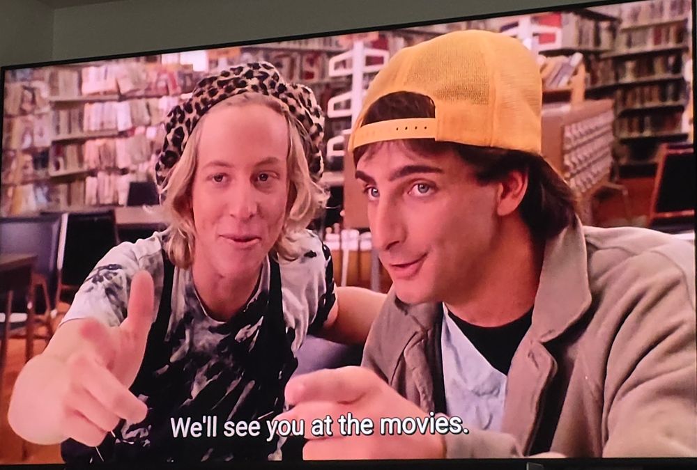 Dave and Chainsaw, two remedial English students, reviewing The Texas Chainsaw Massacre. They point and say We'll see you at the movies.