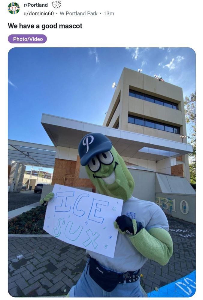 Post on the Portland subreddit from user dominic60 titled "We have a good mascot". It shows the Portland Pickles mascot Dillon T. Pickle in front of the Portland ICE building, holding a sign that says ICE SUX