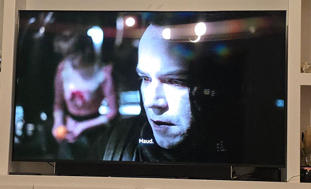 The Creature is in closeup, his face partially in shadow. His face is white and his straight black hair is draped over the left side of his face. He looks down, quite dramatically. It's all so emotional, like the Queensryche video.