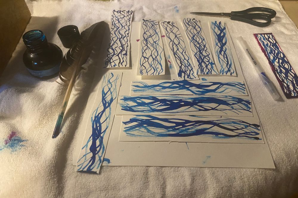Fountain pen ink, goose feather quill, pen, bookmarks art project in progress 