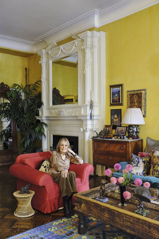 Steinem (wearing a Valentino Blouse, Nili Lotan corduroy trousers, Chanel boots, with a Joseff of Hollywood silver necklace and Karl Lagerfeld prototype bracelets) in the second-floor living room of her New York City residence. Blouse and Jewelry from Lily et Cie; Fashion styling by Nina and Clare Hallworth. 