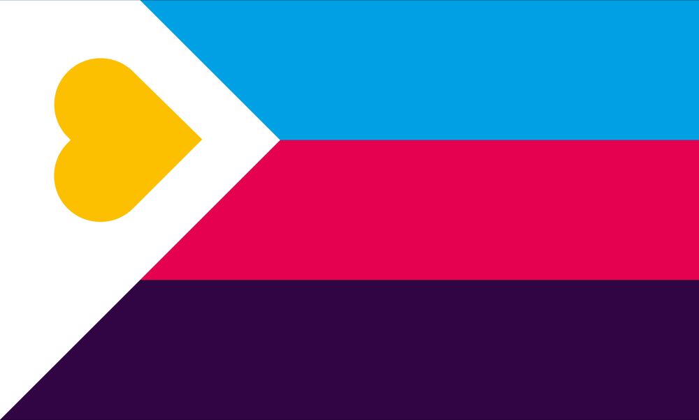 The new Polyamory pride Flag. It has 3 stripes which are light blue, dark pink and purple from top to bottom. The left side had a large white triangle covering part of it with a sideways yellow heart inside. The bottom of the heart is lined up with the tip of the triangle.