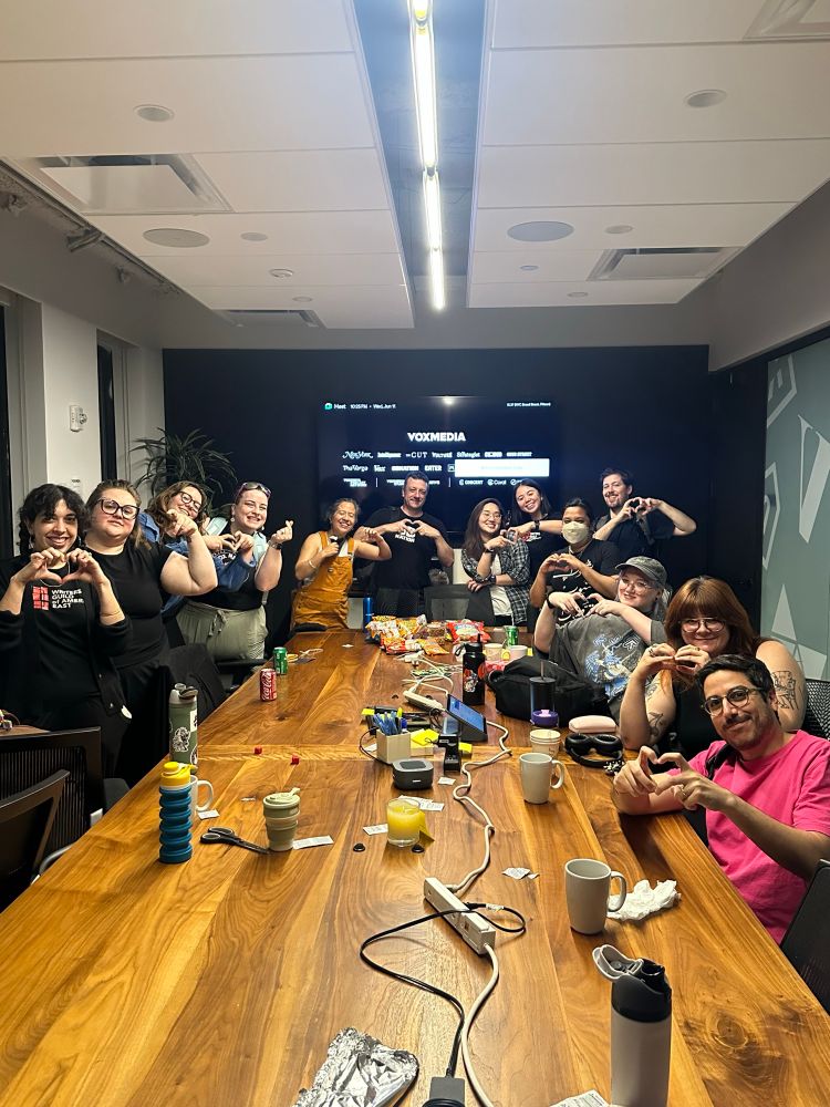 Members of the Vox Media Union bargaining committee gathered around a conference table.