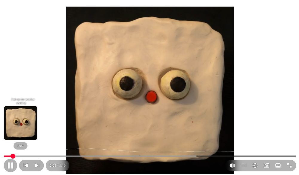 a version of the YouTube video UI overlay that I was surprised to see in my private browser. on the bottom left of the video, the play/pause button is now a circle, the previous/next video arrows are a capsule shape, and the time elapsed/video length is held in a capsule next to it. on the bottom right, a long capsule shape holds the volume, captioning, settings, mini-player, theater mode, and maximize options. even the scrub bar is a very long and thin capsule, with completely rounded ends. the video preview above the indicator of the current timestamp on the scrub bar (itself a circle) has rounded corners. the video, in case you care, is Two Time by Jack Stauber, so the actual visual is just a static image of the album art (a white, roughly-shaped square of clay with two clay eyeballs and a red circular nose in the center), and this applies to the video preview as well.